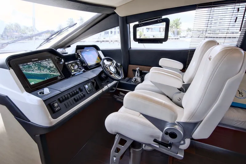 Slide: The Image of Luxurious 2017 Sea Ray L590 Fly yacht cockpit with advanced navigation systems and plush seating. - 49