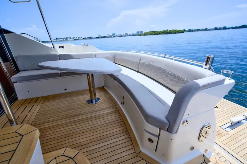 Slide: The Image of Luxurious 2017 Sea Ray L590 Fly yacht with elegant seating and scenic ocean view. - 22