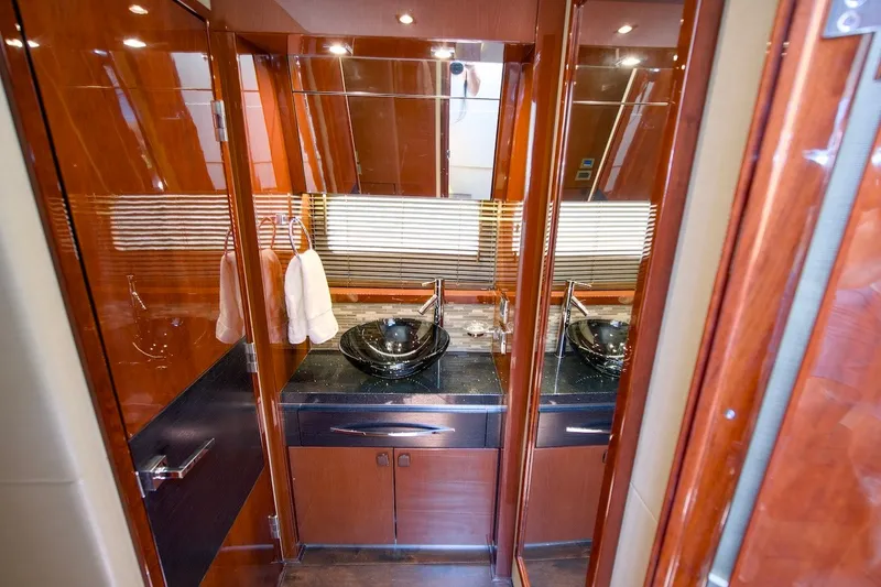 Slide: The Image of Luxurious bathroom interior of 2017 Sea Ray L590 Fly yacht with elegant wood finish. - 55