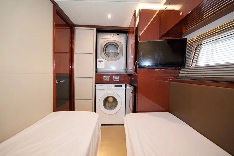Slide: The Image of Interior of 2017 Sea Ray L590 Fly yacht with twin beds, washer-dryer, and TV. - 65