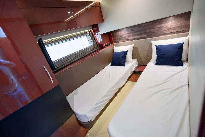 Slide: The Image of Interior cabin of 2017 Sea Ray L590 Fly yacht with twin beds and modern decor. - 62