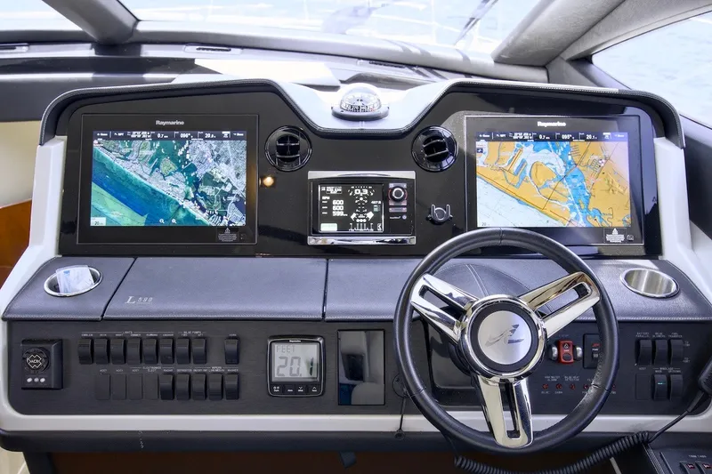 Slide: The Image of Cockpit of 2017 Sea Ray L590 Fly yacht with advanced navigation displays. - 51