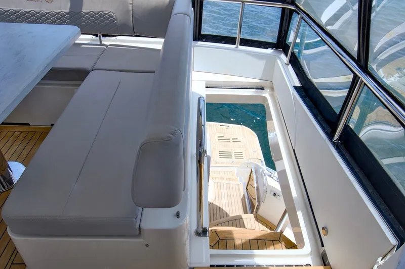 Slide: The Image of Luxurious 2017 Sea Ray L590 Fly yacht interior with elegant seating and teak flooring. - 40