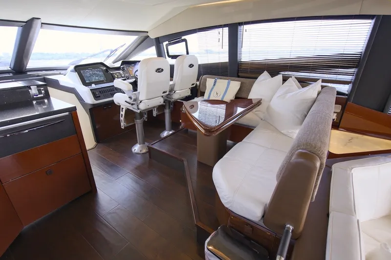 Slide: The Image of Luxurious interior of 2017 Sea Ray L590 Fly yacht with modern helm and plush seating. - 45