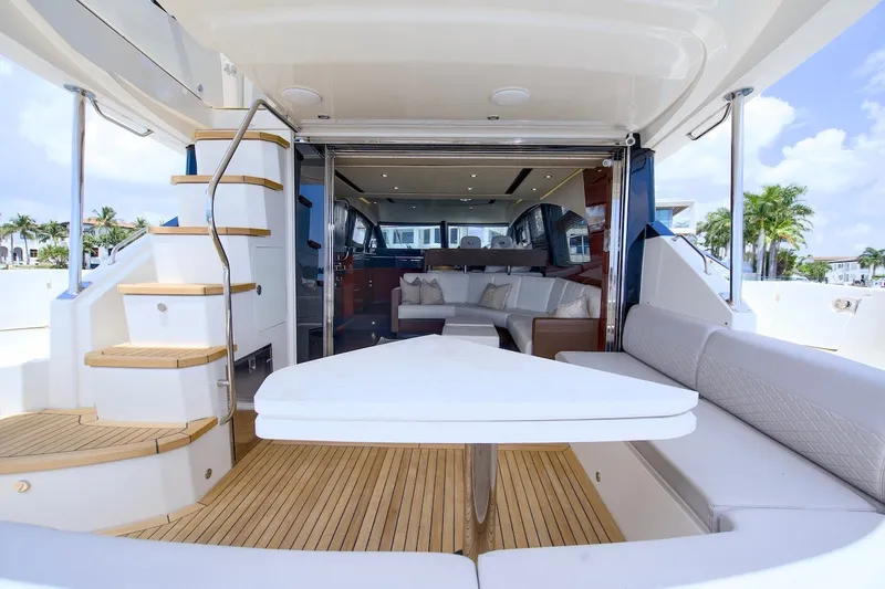 Slide: The Image of Luxurious 2017 Sea Ray L590 Fly yacht interior with elegant seating and wooden flooring. - 24
