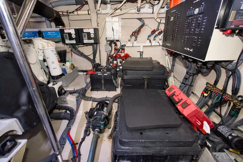 Slide: The Image of Engine room of 2017 Sea Ray L590 Fly yacht, showcasing electrical panels and equipment. - 67