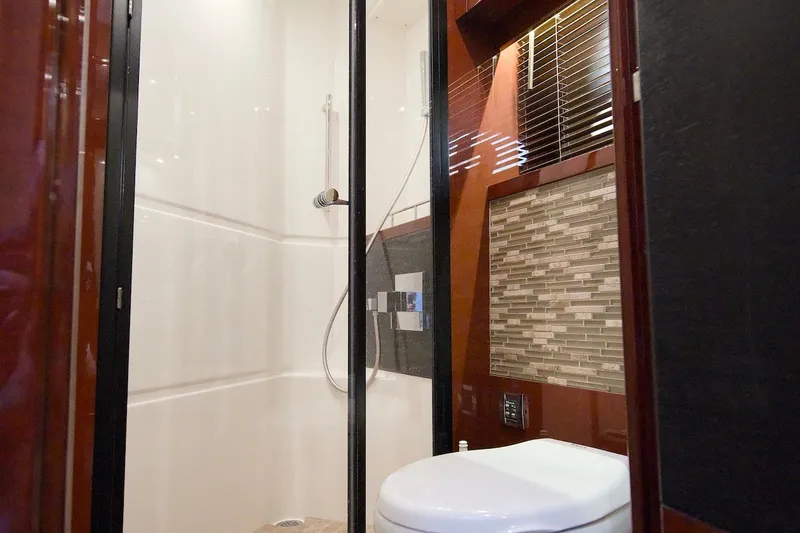 Slide: The Image of Luxurious bathroom interior of 2017 Sea Ray L590 Fly yacht with modern shower and toilet. - 56