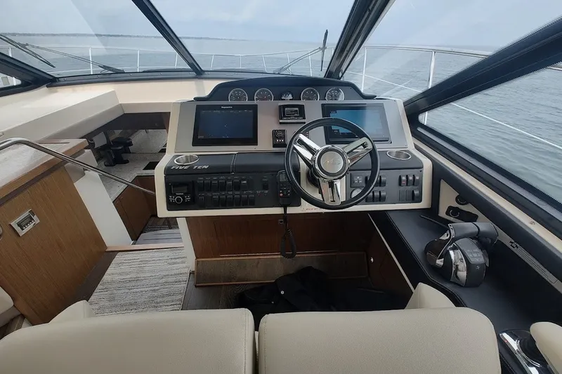 Slide: The Image of Helm of 2017 Sea Ray Sundancer 510 yacht with modern navigation controls. - 20