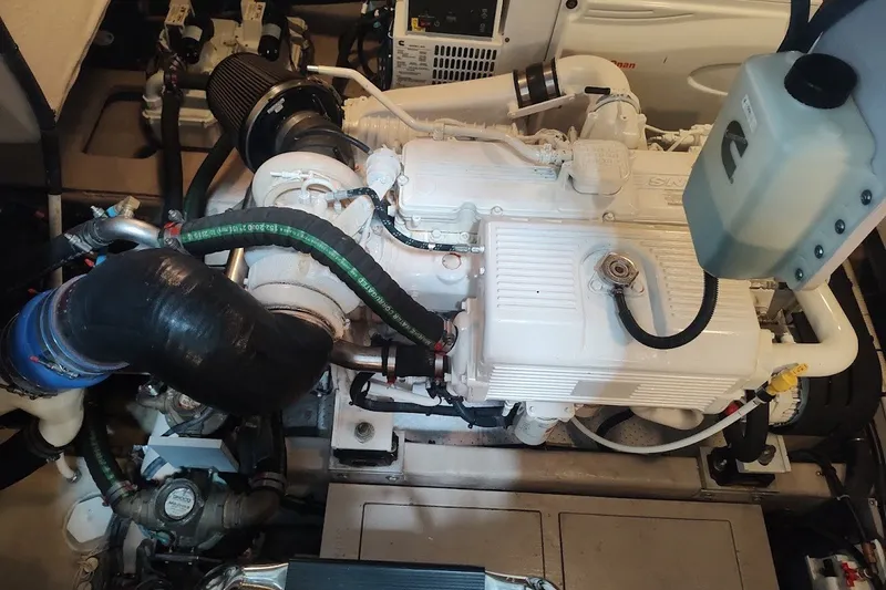 Slide: The Image of Engine compartment of a 2017 Sea Ray Sundancer 510 yacht, showcasing detailed machinery. - 57