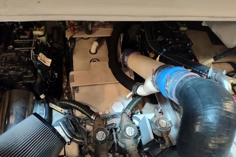 Slide: The Image of Engine compartment of 2017 Sea Ray Sundancer 510 yacht, showcasing mechanical components. - 56