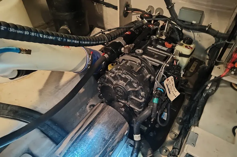 Slide: The Image of Engine compartment of a 2017 Sea Ray Sundancer 510 yacht, showcasing mechanical components. - 53
