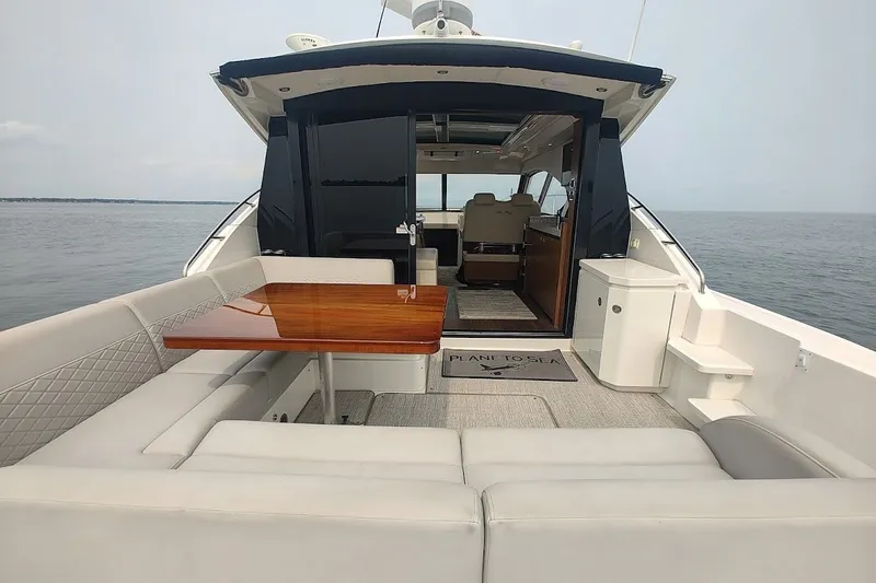 Slide: The Image of Luxurious 2017 Sea Ray Sundancer 510 yacht interior with elegant seating and ocean view. - 13