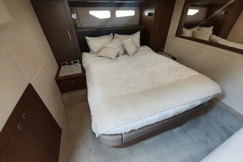 Slide: The Image of Luxurious bedroom interior of 2017 Sea Ray Sundancer 510 yacht with elegant bedding. - 33