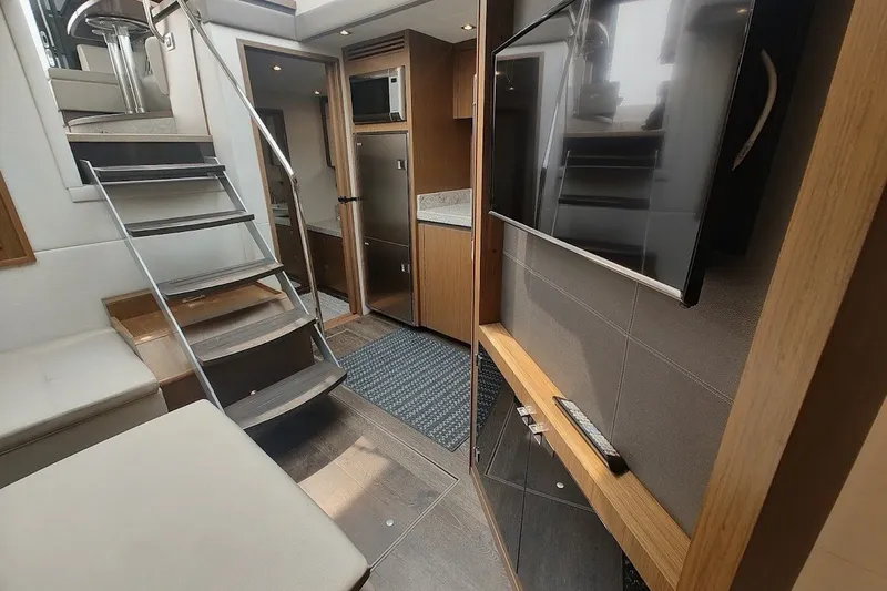Slide: The Image of Interior of 2017 Sea Ray Sundancer 510 yacht with modern amenities and sleek design. - 24