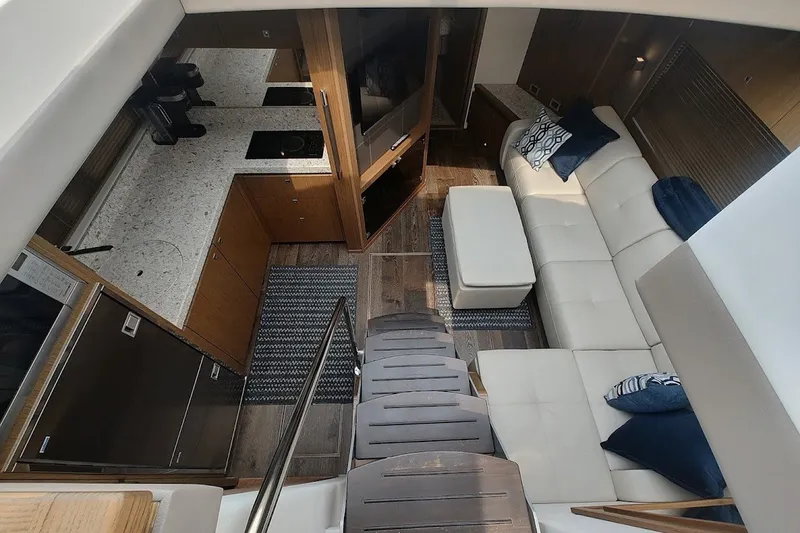 Slide: The Image of Luxurious interior of 2017 Sea Ray Sundancer 510 yacht with modern kitchen and seating area. - 22