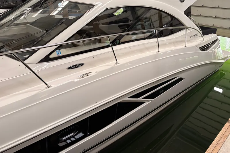 Slide: The Image of 2017 Sea Ray Sundancer 510 yacht docked indoors, showcasing sleek design and modern features. - 42