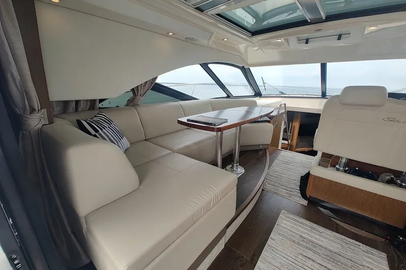 Slide: The Image of Luxurious interior of 2017 Sea Ray Sundancer 510 yacht with elegant seating and panoramic windows. - 19
