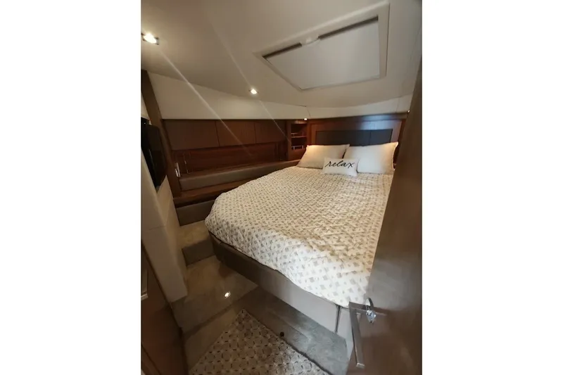 Slide: The Image of Luxurious bedroom interior of 2017 Sea Ray Sundancer 510 yacht with cozy bedding. - 37