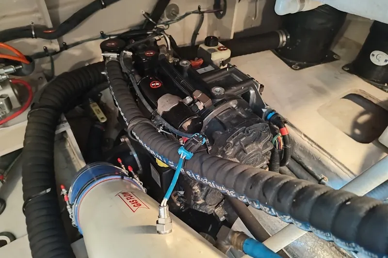 Slide: The Image of Engine compartment of 2017 Sea Ray Sundancer 510 yacht, showcasing mechanical components. - 52