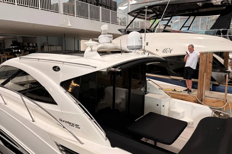 Slide: The Image of 2017 Sea Ray Sundancer 510 yacht in marina, featuring sleek design and modern amenities. - 43