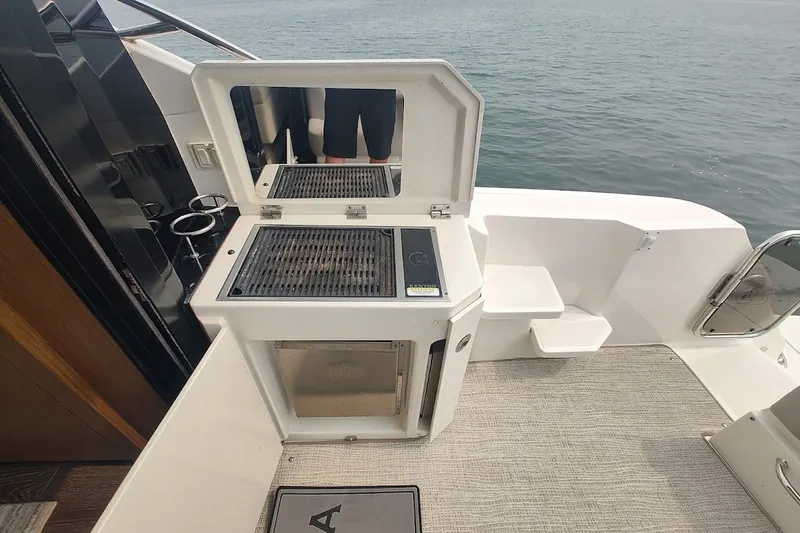 Slide: The Image of Outdoor grill on 2017 Sea Ray Sundancer 510 yacht, overlooking the ocean. - 16