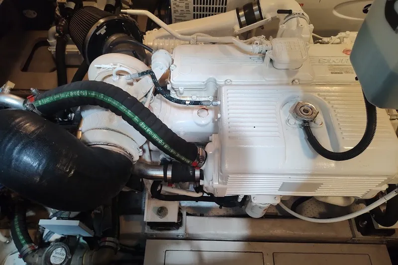 Slide: The Image of Engine compartment of a 2017 Sea Ray Sundancer 510 yacht, showcasing mechanical components. - 54