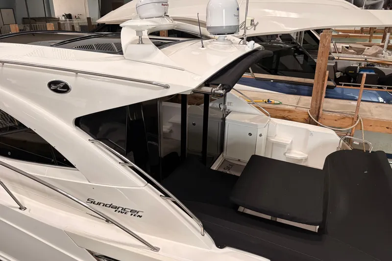 Slide: The Image of 2017 Sea Ray Sundancer 510 yacht in a marina, showcasing sleek design and modern features. - 44
