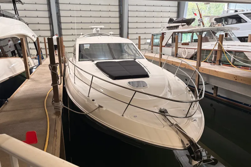 Slide: The Image of 2017 Sea Ray Sundancer 510 yacht docked in a marina, showcasing sleek design and luxury features. - 40