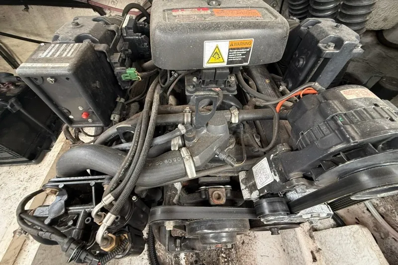 Slide: The Image of Engine of a 2001 Chaparral 230 SSi boat, showcasing mechanical components. - 16