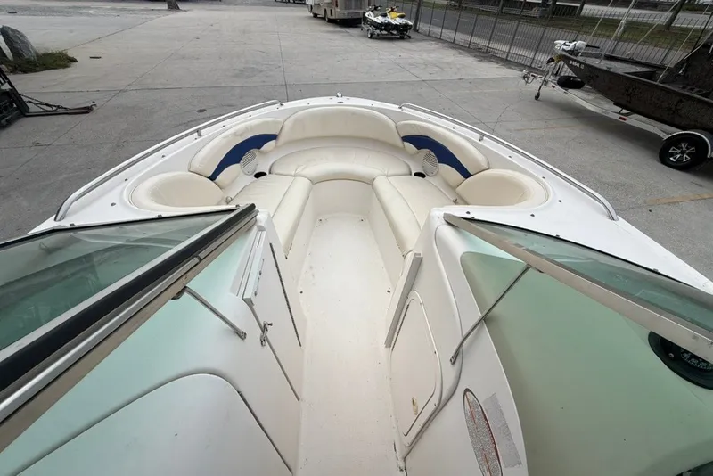 Slide: The Image of 2001 Chaparral 230 SSi boat interior with white seating and open bow design. - 14
