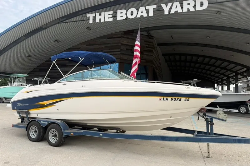 Slide: The Image of 2001 Chaparral 230 SSi boat on trailer at The Boat Yard, with American flag. - 18