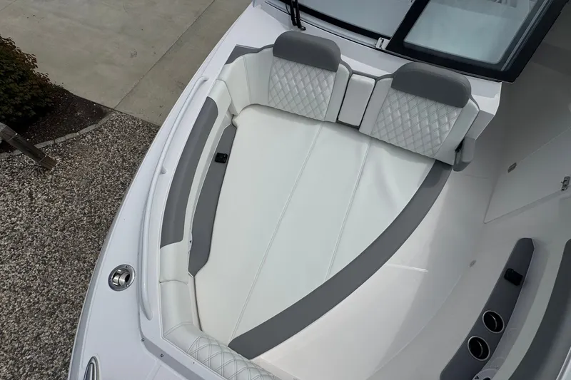 Slide: The Image of Luxurious seating area on 2027 Edgewater 310SC boat, featuring elegant white and gray upholstery. - 47