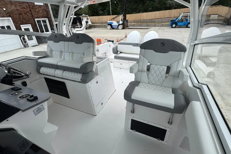 Slide: The Image of Interior of 2027 Edgewater 310SC boat with luxurious seating and modern dashboard. - 33