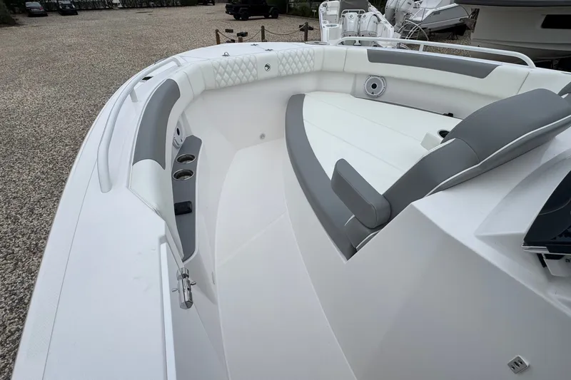 Slide: The Image of Luxurious interior of 2027 Edgewater 310SC boat with sleek seating and cup holders. - 48