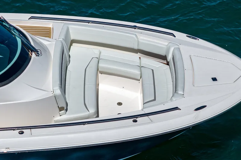 Slide: The Image of The 2024 Tiara Yachts 38 LS features a sleek deck with white upholstery. - 14