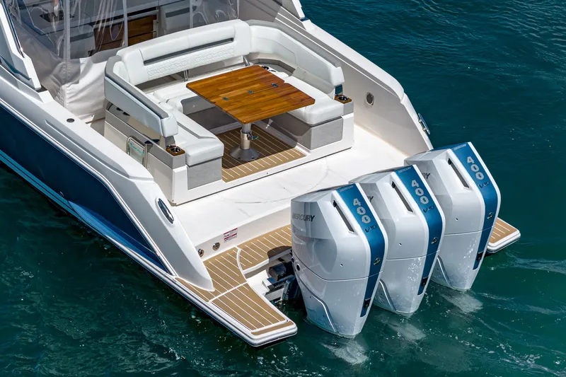 Slide: The Image of The 2024 Tiara Yachts 38 LS features a sleek design with three powerful outboard engines. - 23
