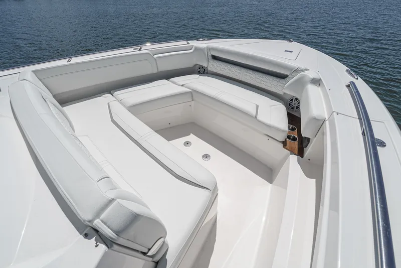 Slide: The Image of The 2024 Tiara Yachts 38 LS features a luxurious white seating area at the bow. - 16