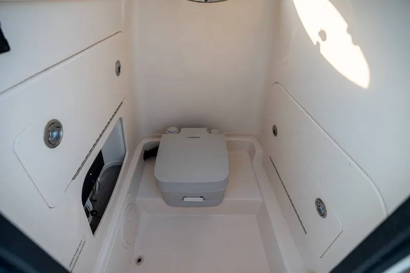 Slide: The Image of Interior of 2022 Grady-White Fisherman 216 boat with compact marine toilet. - 13