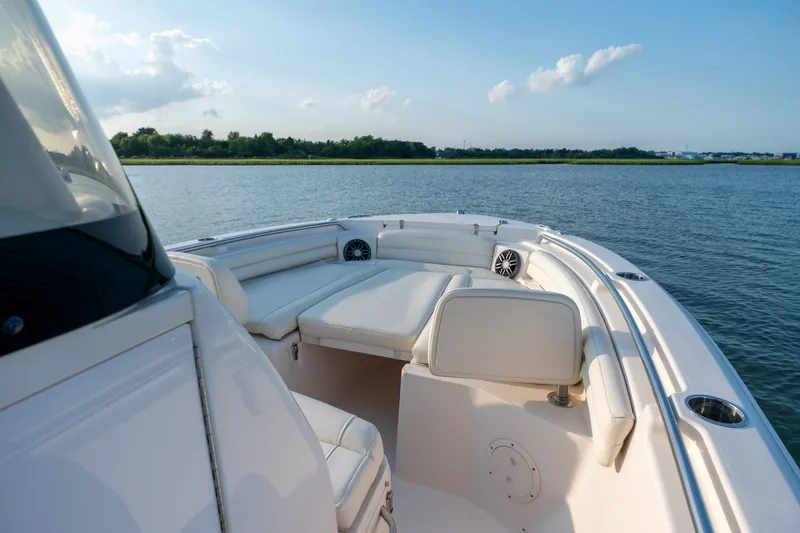 Slide: The Image of 2022 Grady-White Fisherman 216 boat with luxurious seating on calm water. - 17