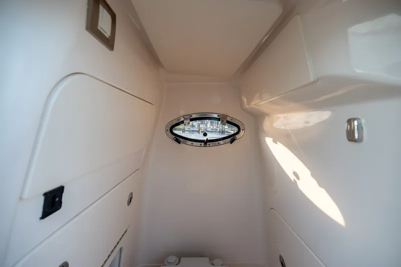 Slide: The Image of Interior cabin of 2022 Grady-White Fisherman 216 boat with porthole window. - 14