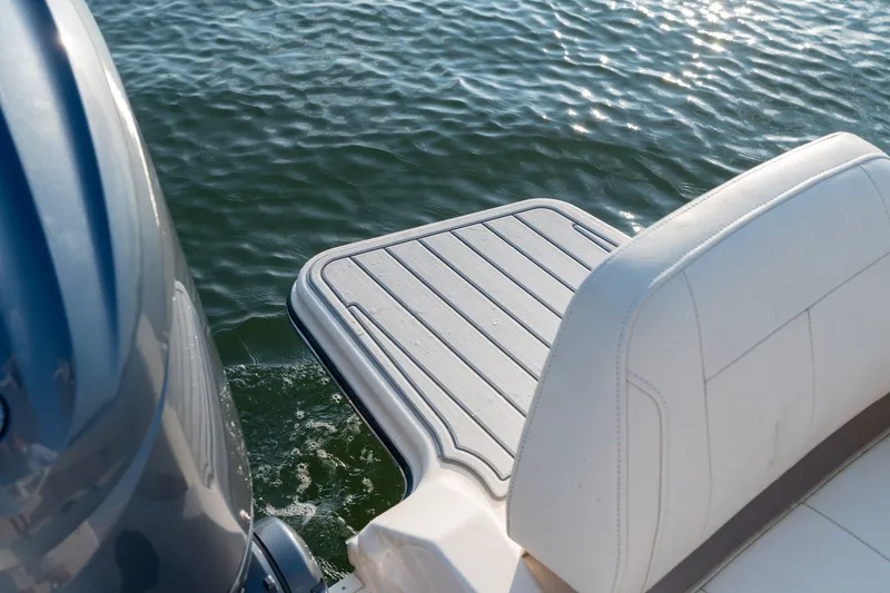 Slide: The Image of 2022 Grady-White Fisherman 216 boat with swim platform and cushioned seating on water. - 25