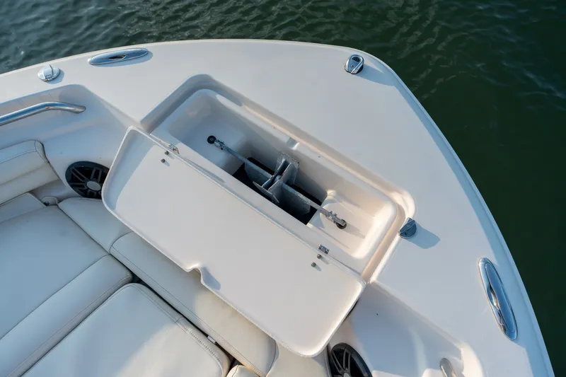 Slide: The Image of 2022 Grady-White Fisherman 216 boat anchor compartment, open on deck. - 20