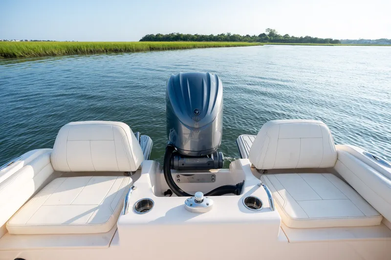 Slide: The Image of 2022 Grady-White Fisherman 216 boat with outboard motor on calm water. - 23