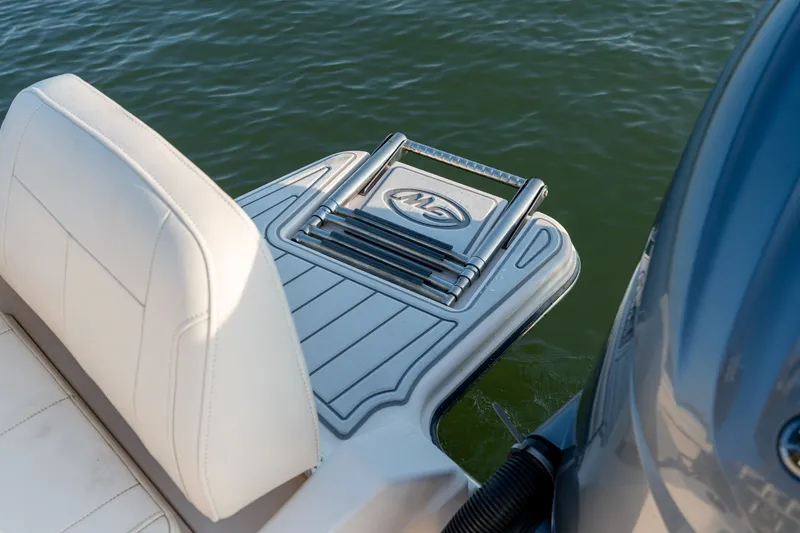 Slide: The Image of 2022 Grady-White Fisherman 216 boat with swim platform and ladder on water. - 24
