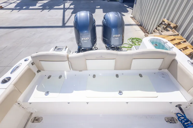 Slide: The Image of 2017 NauticStar 2602 Legacy boat with twin Yamaha 150 engines, spacious deck layout. - 44