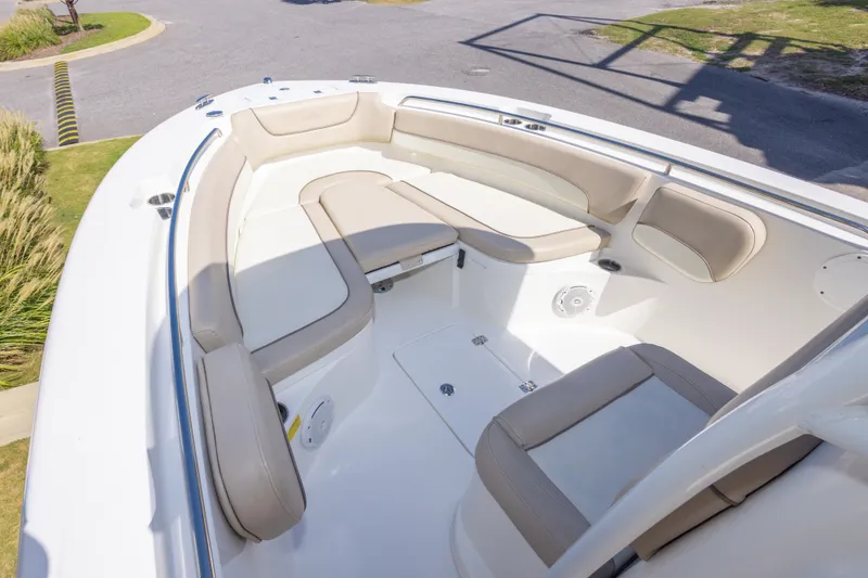 Slide: The Image of 2017 NauticStar 2602 Legacy boat interior with cushioned seating and spacious layout. - 24