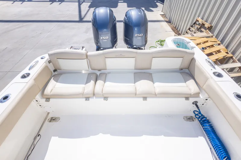 Slide: The Image of 2017 NauticStar 2602 Legacy boat with dual 150 engines and spacious seating area. - 36