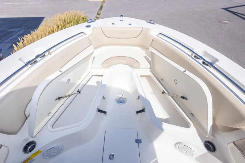 Slide: The Image of 2017 NauticStar 2602 Legacy boat interior with open storage compartments. - 30