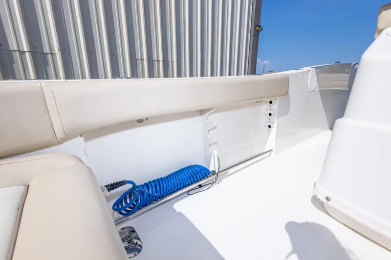 Slide: The Image of 2017 NauticStar 2602 Legacy boat interior with seating and storage compartment. - 39