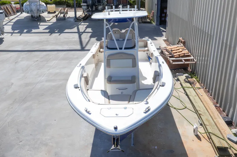 Slide: The Image of 2017 NauticStar 2602 Legacy boat docked in a marina, top view. - 3